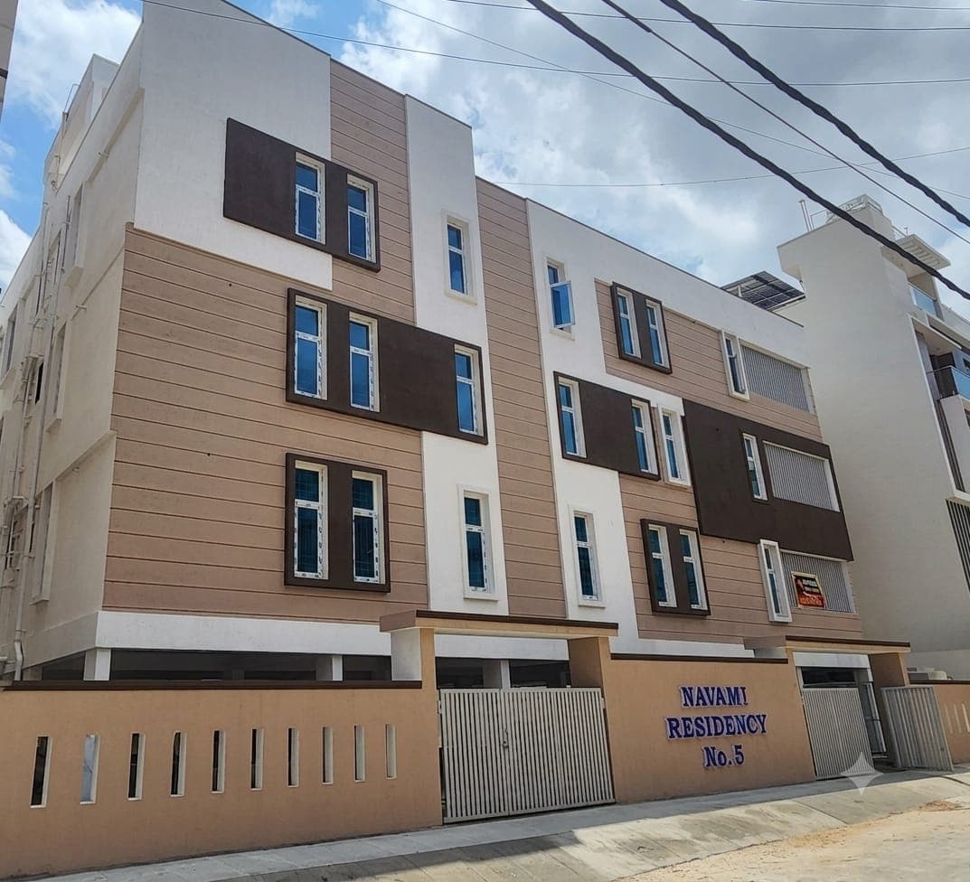 Multi-storey residential apartment building by Bhat Bhai Builders